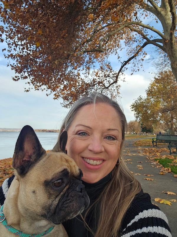 Katie Julison, owner of Doody Pros, with one of her French bulldogs
